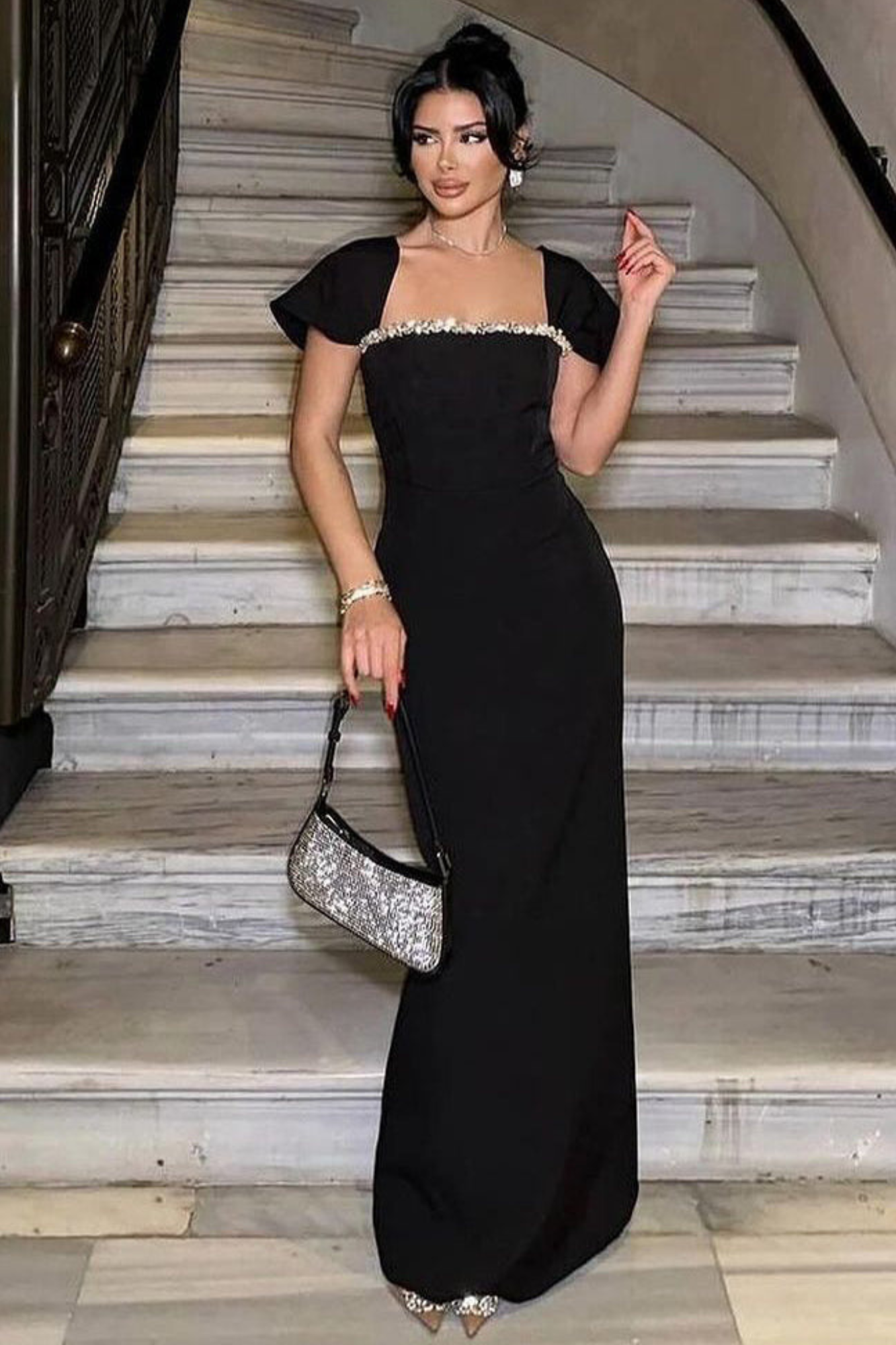 Front view of the Black Neck Rhinestone Low Slit Maxi Dress showcasing the elegant rhinestone neckline, sleeveless design, and floor-length silhouette.