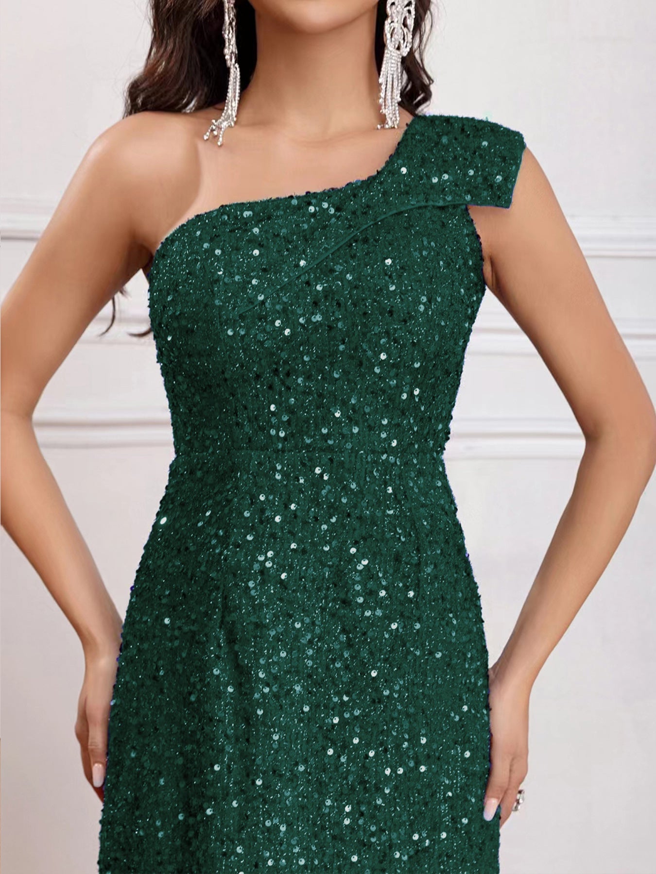 Close-up detail view of the Green Sleeveless One-Shoulder High Slit Sequins Maxi Dress, showcasing its shimmering sequins and high-quality craftsmanship.