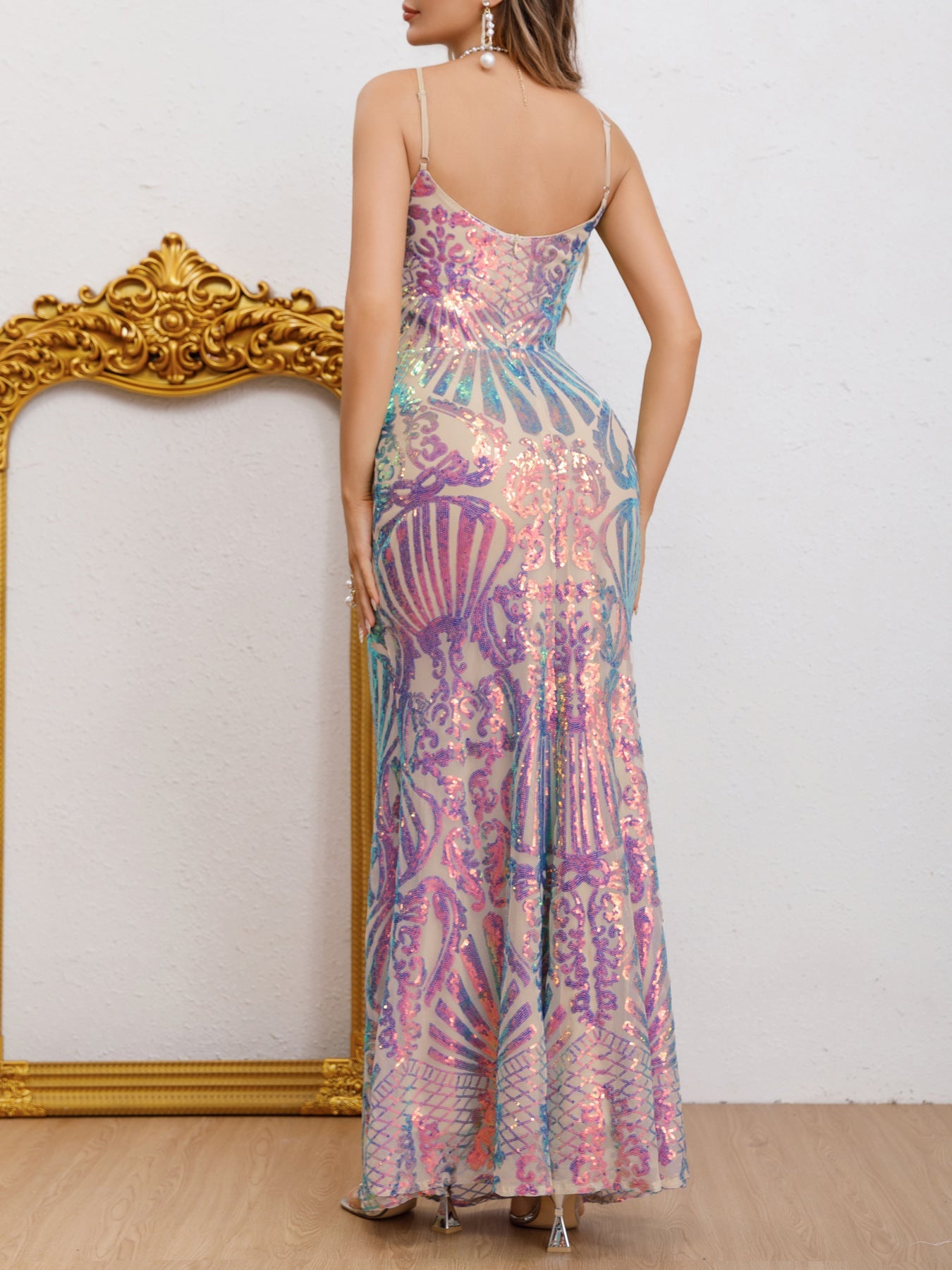 Back view of the multicolor mermaid dress highlighting the backless design, sleek mesh fabric, and shimmering multicolor sequin details.