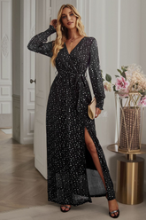 Side view of Black Long Sleeve Rhinestone Mesh Maxi Dress showcasing the side slit and elegant fit.