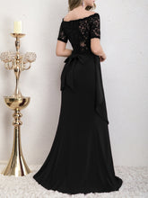Back view of the Yedda black short sleeve embroidered lace spliced A-line dress, featuring the lace splicing and bow detail.