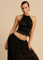 Close-up of the pleated chiffon fabric and lace-up back of the Black Chiffon Backless Lace-up Pleated Maxi Dress, showcasing the intricate details and premium quality.