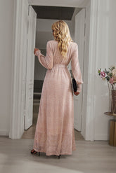 Back view of Champagne Long Sleeve Rhinestone Mesh Maxi Dress with long sleeves and a flowing maxi-length design.