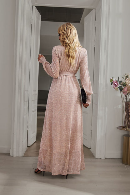 Back view of Champagne Long Sleeve Rhinestone Mesh Maxi Dress with long sleeves and a flowing maxi-length design.