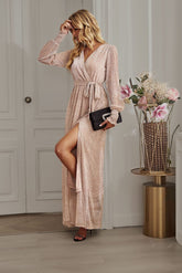 Side view of Champagne Long Sleeve Rhinestone Mesh Maxi Dress showcasing the side slit and elegant fit.