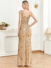Back view of a champagne mermaid dress with a sophisticated backless design and flowing mermaid skirt for a timeless formal look.