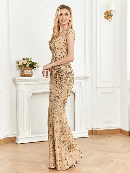 Side view of a champagne mermaid evening gown showcasing a figure-hugging silhouette, intricate sequin details, and a graceful flare at the hem.