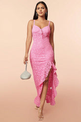A woman is wearing a pink lace dress with a sleeveless and backless design. The dress features intricate embroidery on the lace fabric, and the adjustable suspenders provide a relaxed yet stylish fit. The front view highlights the flattering cut and the delicate lace texture, perfect for outdoor events or casual leisure activities.