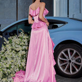The back view of the Pink Satin Ruffle Patchwork Suspender Dress reveals the full-length maxi design with its smooth satin finish and adjustable suspender straps. The ruffle patchwork detailing continues along the back, adding dimension and texture.