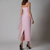 Back view of the pink sleeveless pleated mesh splicing stretch maxi dress, showing the stylish backless design.