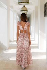 Back view of the Pink Sleeveless Ruffle Floral Chiffon Hollow Maxi Dress featuring the open-back design and elegant tie closure.
