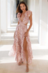 Front view of the Pink Sleeveless Ruffle Floral Chiffon Hollow Maxi Dress showcasing the deep V-neckline and elegant floral ruffle details.