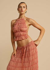 Close-up of the pleated chiffon fabric and lace-up back of the Pink Chiffon Backless Lace-up Pleated Maxi Dress, showcasing the intricate details and premium quality.