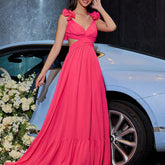 Close-up detail view of the Red Chiffon Backless Cross-Tie Flower Suspender Evening Dress highlighting the floral suspender straps and luxurious chiffon fabric.