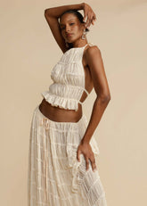 Close-up of the pleated chiffon fabric and lace-up back of the White Chiffon Backless Lace-up Pleated Maxi Dress, showcasing the intricate details and premium quality.